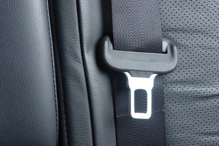 Car seatbelt on the black leatherの写真素材