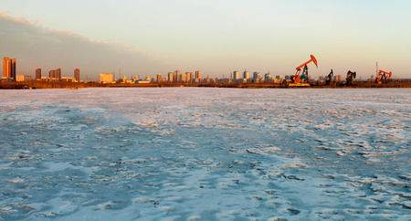 Sunset at oil fieldの写真素材