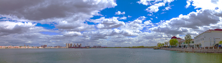Landscape view of a lake with buildings at the lake sideのeditorial素材
