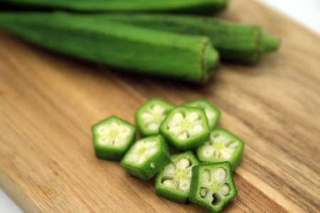 multiple okra cut with cutting boards