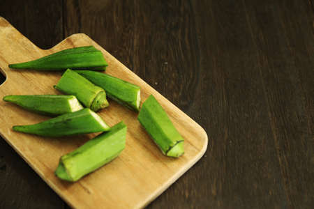 multiple okra cut with cutting boardsの写真素材