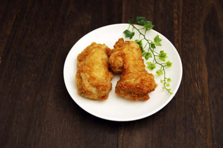 Fried chicken on a wooden tableの写真素材