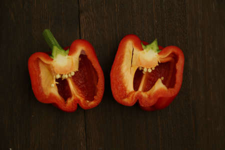 Half-cut paprika on a wooden tableの写真素材