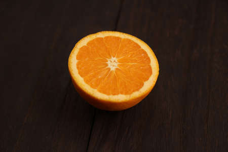 Orange placed on a wooden tableの写真素材