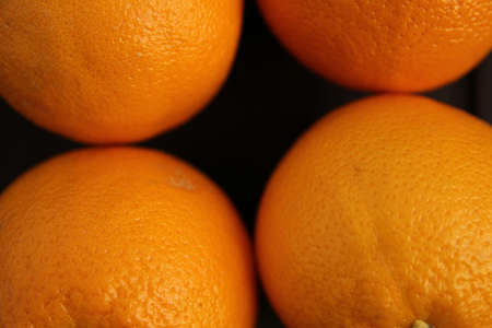 Orange placed on a wooden tableの写真素材