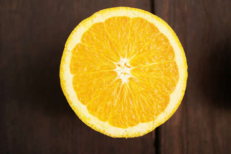 Orange placed on a wooden tableの写真素材