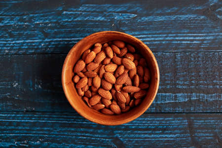 Almonds in a bowl on the tableの写真素材