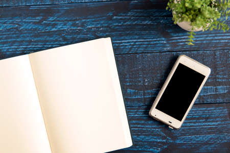 One notebook on the blue tableの写真素材