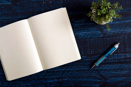 One notebook on the blue tableの写真素材