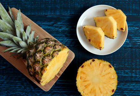 Cut pineapple placed on the tableの写真素材