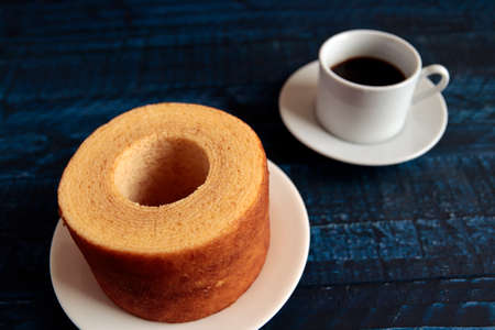 Eating Baumkuchen as a gift at a wedding ceremony at the table at tea timeの写真素材