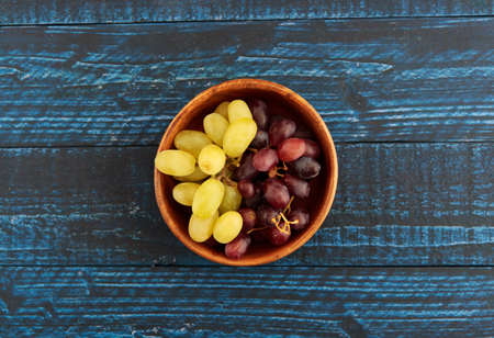 The grapes that are the source of the wine on the tableの写真素材