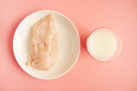 Raw chicken breast on the tableの写真素材