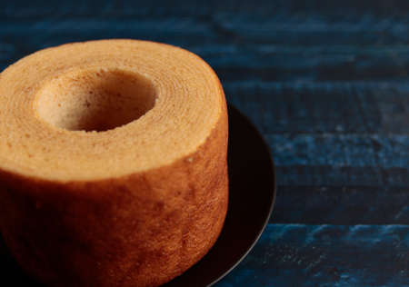 Eating Baumkuchen as a gift at a wedding ceremony at the table at tea timeの写真素材