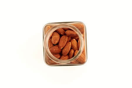 Almond nuts in a jar on the tableの写真素材