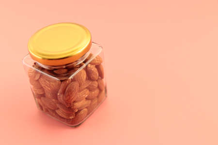 Almond nuts in a jar on the tableの写真素材