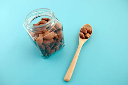 Almond nuts in a jar on the tableの写真素材