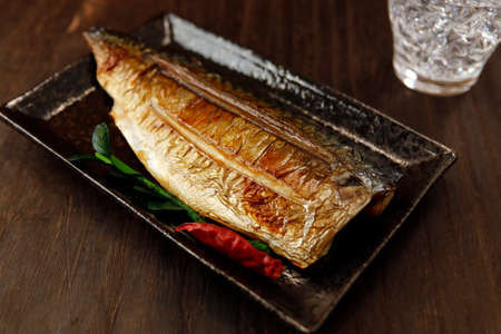 Grilled fish dish mackerel on the tableの写真素材