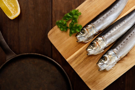 Squid that is the ingredient for multiple freshly caught fish dishes on the tableの写真素材