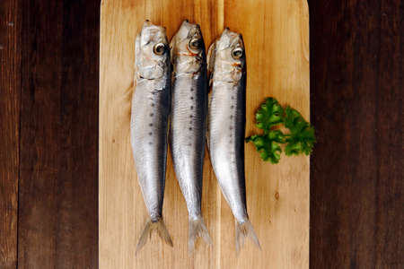 Dried horse mackerel on the tableの写真素材