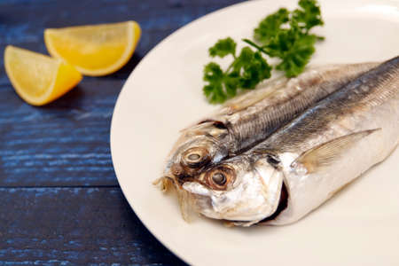 Dried horse mackerel on the tableの写真素材