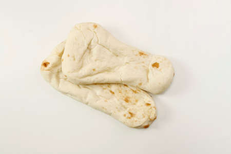 Nan made from wheat to eat with Indian curry on the tableの写真素材