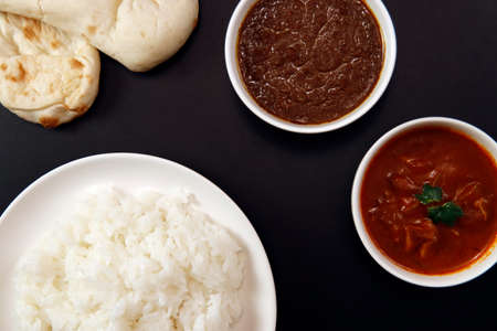 Indian curry and rice on the tableの写真素材