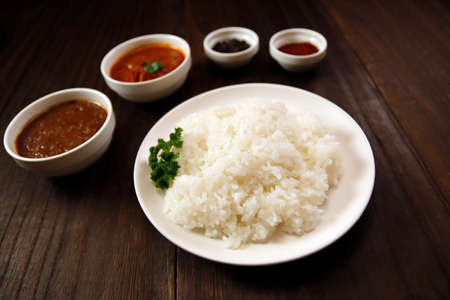 Indian curry and rice on the tableの写真素材