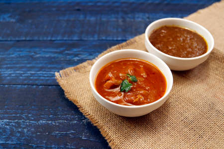 Indian chicken curry roux like tomato soup on the tableの写真素材
