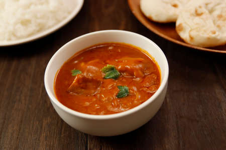 Indian chicken curry roux like tomato soup on the tableの写真素材