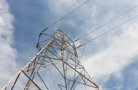 The transmission tower on blue sky backgroundの写真素材