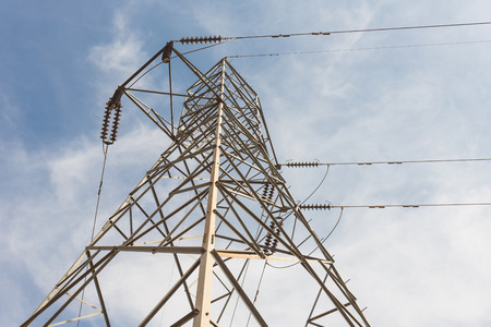 The transmission tower on blue sky backgroundの写真素材