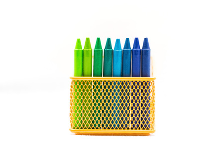rainbow crayon colored on the orange basketの写真素材