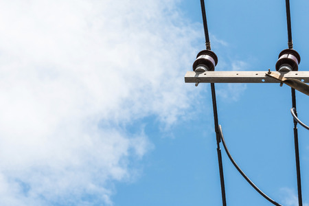 street lamp and cable on the blue sky