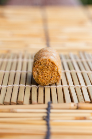 Crispy roll with dried shredded pork on a bamboo pad.の写真素材