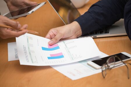 Hands of professionals meeting about project budget in the office in business teamwork conceptの写真素材