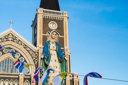 The Blessed Virgin Mary,mother of Jesus on the blue sky, in front of the Roman Catholic Diocese, public place in Chanthaburi, Thailand.の写真素材