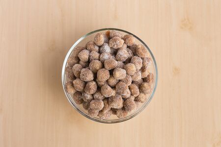 Tamarind candies mix with sugar on wooden backgroundの写真素材