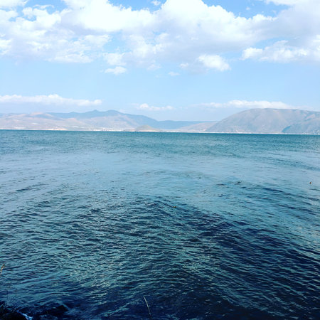 Beautiful seascape with blue sea and cloudy sky, nature backgroundの写真素材