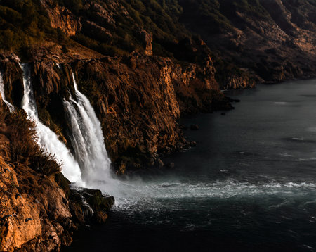 Waterfall in the Black Sea at sunset. Crimea, Ukraine.