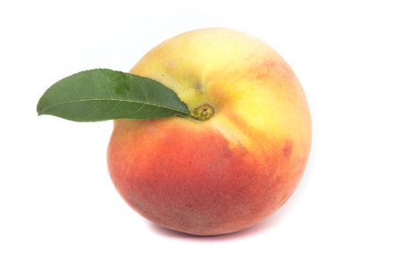 Fresh peach with leaf isolated on white backgroundの写真素材