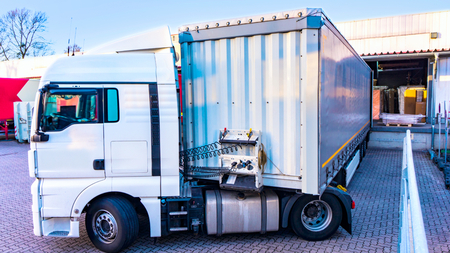 Loading Lorry Trailer. Truck on the road. Commercial transport. truck transport containerの写真素材