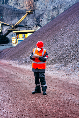 Heavy industry. Hard work. red protective helmet. Safety helmet. worker clothes