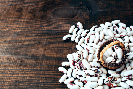 White beans. Colorful variety mixed beans. on a wooden table.の写真素材