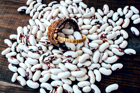 White beans. Colorful variety mixed beans. on a wooden table.