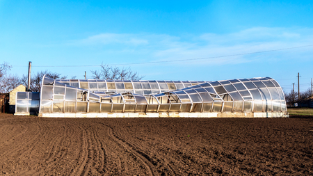 Exterior of broken greenhouse. Destroyed greenhousesの写真素材