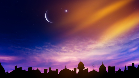 Mosque silhouette against the background of sky. Perfect sunset. Crescent moon with beautiful sunset background. Generous ramadanの写真素材