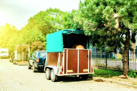 Funny horse transport. Carriage for horses on the high wayの写真素材