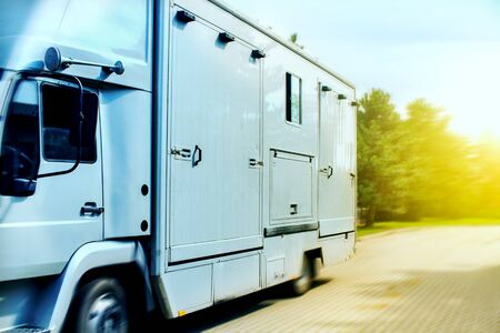 Horse transportation van. Funny horse transport. Carriage for horses on the high way