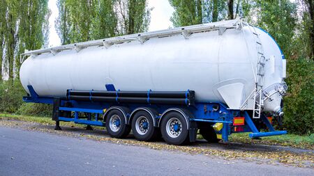 Semi-trailers of bulk tank. Truck big cistern. Modern semi-trailers for freight transport. Dry cargo